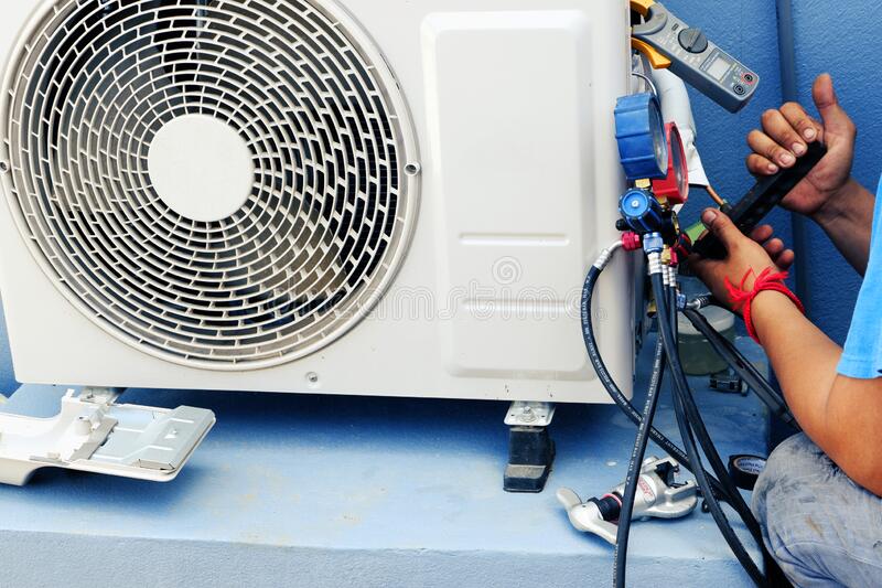 air conditioning technician repairing air conditioner leakage air solution pipe joint air conditioning 188715175